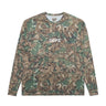 Front view of a long-sleeve athletic T-shirt featuring an all-over brown, olive green, and cream camouflage-style print, a white “DÉPT.” logotype at the center chest, a crew neckline, and contrasting brown seam detailing along the shoulders, sides, cuffs, and hem. The relaxed-fit shirt is made from breathable athletic fabric. Displayed against a plain white background.