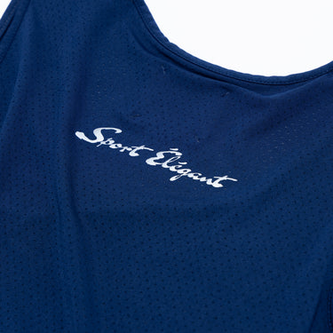 Close-up of the white “Sport Elegant” script lettering below the neckline on the back of a navy blue athletic tank top, highlighting the printed typography and perforated fabric texture.