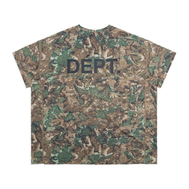 Back view of a unisex short-sleeve athletic T-shirt featuring an all-over brown, olive green, and cream camouflage-style print with an enlarged black “DÉPT.” logo across the upper back. The boxy-fit shirt has a crew neckline and contrasting brown seam detailing along the sides and sleeves. Displayed against a plain white background.