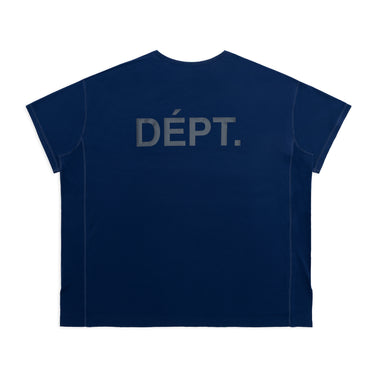 Back view of a unisex short-sleeve athletic T-shirt in navy blue, featuring an enlarged dark “DÉPT.” logotype across the upper back. The boxy-fit shirt has a crew neckline, tonal seam detailing along the shoulders, sleeves, and sides, and a perforated lower hem panel. Displayed against a plain white background.