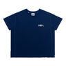 Front view of a unisex short-sleeve athletic T-shirt in navy blue, featuring a small white “DÉPT.” logotype on the left chest, a crew neckline, and contrasting tonal seam detailing along the shoulders, sleeves, and sides. The boxy-fit shirt is made from breathable perforated athletic fabric with a perforated panel extending along the lower hem. Displayed against a plain white background.