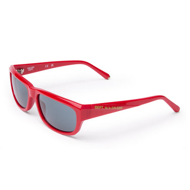 Front top view of red rectangular sunglasses with dark gray lenses, 'DEPT. de la GALERE' embedded logo in gold on the temple arm, gold 'G-Ball' studs on the ear tip, shown on a plain white background.