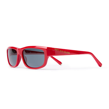 Red rectangular sunglasses with dark gray lenses, 'DEPT. de la GALERE' embedded logo in gold on the temple arm, gold 'G-Ball' studs on the ear tip, shown on a plain white background.