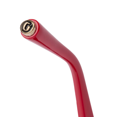 Top view of an ear tip detail shot of red sunglasses with a gold 'G-Ball' stud on the ear tip, shown on a plain white background.
