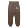 A pair of washed brown jogger sweatpants with white printed text reading 'DÉPT. de la GALERIE' on the upper right leg, shown flat against a white background.